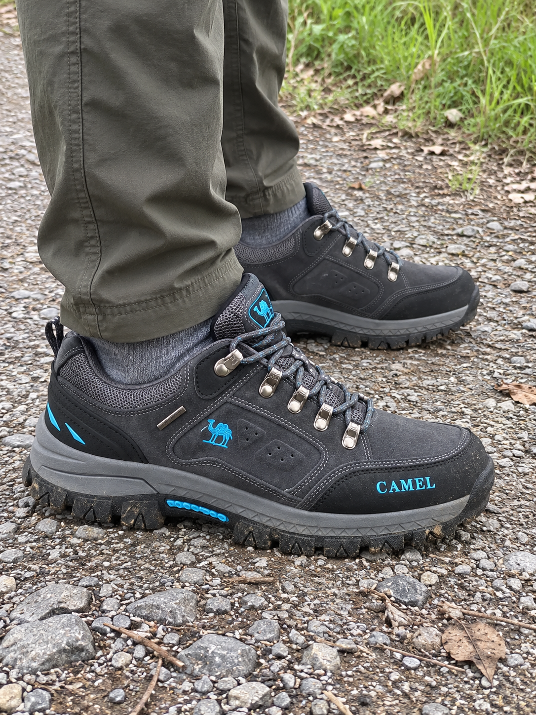 Grey low-cut hiking shoes on a gravel path